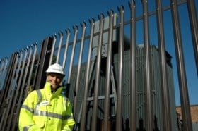 Engineer stood in front of electrical equipment