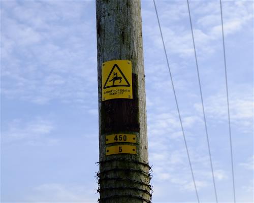 Danger of death sign on an overhead powerline