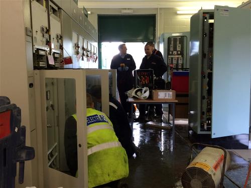 Engineers working in a flooded house