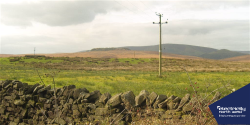 Power lines in the middle of a field