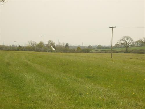 Field with overhead power lines